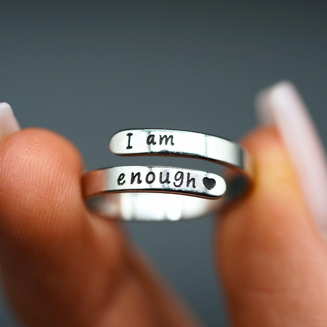 Close-up of the I am enough lettering on the wrap ring